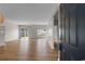 Spacious living room with hardwood floors, sliding glass door, and plenty of natural light at 207 Cupola Dr., Longs, SC 29568