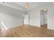Expansive living area with wood flooring and access to other rooms at 207 Cupola Dr., Longs, SC 29568