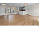 Open-concept living area featuring wood floors and natural light at 207 Cupola Dr., Longs, SC 29568