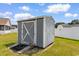 A backyard storage shed with a ramp, providing ample space for tools and equipment at 207 Cupola Dr., Longs, SC 29568