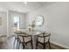 Bright dining area features contemporary furnishings and a door leading to an outdoor space at 330 Bayou Loop # Lot 68, Surfside Beach, SC 29575