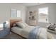 Cozy bedroom with stylish decor, including floating shelves, playful artwork, and a comfortable accent chair at 332 Bayou Loop # Lot 69, Surfside Beach, SC 29575