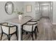 Cozy dining room with stylish chairs, wood floors, and soft, neutral decor at 332 Bayou Loop # Lot 69, Surfside Beach, SC 29575
