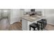 Bright kitchen with granite countertops, island with seating, and stainless steel appliances at 332 Bayou Loop # Lot 69, Surfside Beach, SC 29575