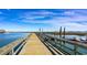 Long wooden pier stretching out into calm waters with distant waterfront buildings at 332 Bayou Loop # Lot 69, Surfside Beach, SC 29575