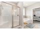 Bathroom featuring a glass-enclosed shower, soaking tub, and access to the main bedroom at 349 N Bar Ct., Myrtle Beach, SC 29579