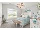 Bright bedroom with vaulted ceilings, a window, and white wooden bed at 349 N Bar Ct., Myrtle Beach, SC 29579