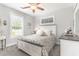 Comfortable bedroom with a ceiling fan, natural light, and neutral tones for a relaxing atmosphere at 349 N Bar Ct., Myrtle Beach, SC 29579