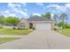Charming one-story home with a brick facade, well-manicured lawn, and attached garage at 349 N Bar Ct., Myrtle Beach, SC 29579