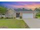 Inviting home showcasing a brick exterior, well-kept lawn, and a two-car garage at 349 N Bar Ct., Myrtle Beach, SC 29579