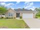 Charming brick home with a well-manicured lawn, a two-car garage, and inviting front entrance at 349 N Bar Ct., Myrtle Beach, SC 29579