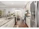 Modern kitchen with granite countertops, stainless steel appliances, and an open view into the dining room at 349 N Bar Ct., Myrtle Beach, SC 29579