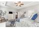 View of main bedroom showcasing stylish furnishings, trey ceiling and access to other rooms at 349 N Bar Ct., Myrtle Beach, SC 29579