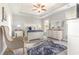 Serene main bedroom with tray ceiling, plush carpet, elegant furniture, and lots of natural light at 349 N Bar Ct., Myrtle Beach, SC 29579