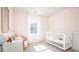 Bright Bedroom with crib, desk, and large window at 378 Ladyfish Loop, Sunset Beach, NC 28468