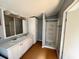Bathroom with a double sink vanity, large mirror, and a shower with a white shower stall at 3802 Stern Dr., Conway, SC 29526