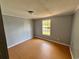 Simple bedroom with a laminate floor, neutral walls, and a window for natural light at 3802 Stern Dr., Conway, SC 29526