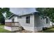 Charming mobile home featuring light gray siding and a small wooden porch with traditional railings at 3802 Stern Dr., Conway, SC 29526