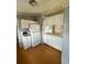 Efficient kitchen layout with white appliances, laminate flooring and classic style cabinets at 3802 Stern Dr., Conway, SC 29526