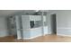 Open living area with laminate flooring, breakfast bar, and neutral paint colors at 3802 Stern Dr., Conway, SC 29526