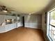 Open-concept living area with laminate flooring, ceiling fan, and view to kitchen at 3802 Stern Dr., Conway, SC 29526