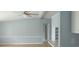 Living room view with vaulted ceilings, ceiling fan, and view to kitchen and hallway at 3802 Stern Dr., Conway, SC 29526