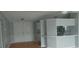 A bright living room boasts double doors and a kitchen view with breakfast bar at 3802 Stern Dr., Conway, SC 29526