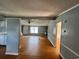 Open concept living area features laminate floor, neutral walls, and a view to entry door at 3802 Stern Dr., Conway, SC 29526