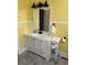 A yellow bathroom featuring a white vanity, sink and decorative mirror at 402 Gibson St., Marion, SC 29571