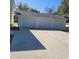 Three car detached garage featuring three bays and a wide concrete driveway at 402 Gibson St., Marion, SC 29571