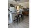 Kitchen with kitchen island with seating, refrigerator, and cabinets at 402 Gibson St., Marion, SC 29571