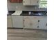 Functional kitchen featuring white cabinets, a dishwasher, and a countertop with contrasting colors at 402 Gibson St., Marion, SC 29571