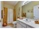 Neutral-toned bathroom featuring a shower/tub combo, a large mirror, and a vanity with storage at 4215 Coquina Harbour Dr. # D -2, Little River, SC 29566