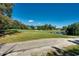 Scenic golf course view with lush green fairway, trees, and a clear blue sky at 4215 Coquina Harbour Dr. # D -2, Little River, SC 29566