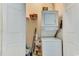 Functional laundry area with stacked washer and dryer, shelving, and storage solutions at 4215 Coquina Harbour Dr. # D -2, Little River, SC 29566
