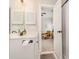 Bathroom featuring a vanity with solid surface countertop and decorative mirror at 4709 Wild Iris Dr. # 101, Myrtle Beach, SC 29577