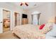 Comfortable bedroom with natural light, ceiling fan, and view into connected room at 4709 Wild Iris Dr. # 101, Myrtle Beach, SC 29577