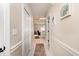 Neutral hallway featuring white tile flooring and access to other rooms at 4709 Wild Iris Dr. # 101, Myrtle Beach, SC 29577