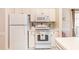 Functional kitchen showcasing white appliances, ample counter space, and natural light at 4709 Wild Iris Dr. # 101, Myrtle Beach, SC 29577