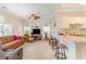 Open living space with modern furnishings, ceiling fan, and breakfast bar at 4709 Wild Iris Dr. # 101, Myrtle Beach, SC 29577