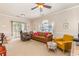 Bright living room with plush seating, large window and sliding door to patio at 4709 Wild Iris Dr. # 101, Myrtle Beach, SC 29577