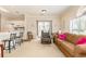 Open-concept living area with breakfast bar, comfortable seating, and patio access at 4709 Wild Iris Dr. # 101, Myrtle Beach, SC 29577