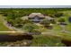 Aerial view of luxurious home with expansive backyard, golf course, and pond views at 486 Lantana Circle, Georgetown, SC 29440
