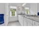 Bright bathroom with a double sink vanity and a large window providing ample natural light at 486 Lantana Circle, Georgetown, SC 29440