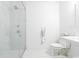 Modern bathroom featuring glass shower with dual showerheads, a toilet, and pedestal sink at 486 Lantana Circle, Georgetown, SC 29440