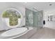 Luxurious bathroom boasting a standalone tub, glass shower, and double sink vanity at 486 Lantana Circle, Georgetown, SC 29440