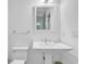Clean bathroom featuring a pedestal sink, toilet, and classic fixtures at 486 Lantana Circle, Georgetown, SC 29440