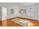 Spacious bedroom with elegant wainscoting, trim, and a ceiling fan at 486 Lantana Circle, Georgetown, SC 29440