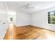 Sunlit bedroom with hardwood flooring, a ceiling fan and lots of closet space at 486 Lantana Circle, Georgetown, SC 29440