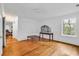 Bright bedroom with hardwood floors, neutral walls and natural light from the large window at 486 Lantana Circle, Georgetown, SC 29440